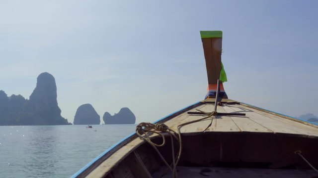 POV from the long-tailed boat sails on the Andaman sea among a lot of Thail islands 