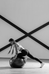 Young beautiful athlete is posing in studio