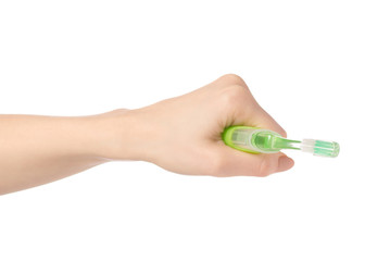 Travel green toothbrush in hand