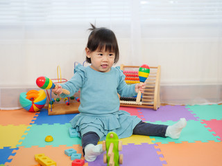 baby girl play maracas at home