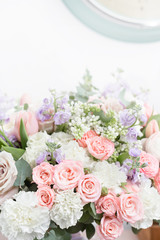 flower shop concept. Close-up beautiful luxury bouquet of mixed flowers on wooden table. Wallpaper