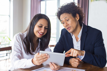 Business partners reading information online