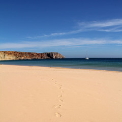 beautiful empty beach with footprints- Sagres, Portugal