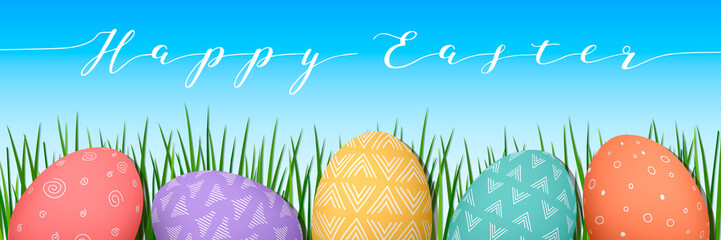 Easter colorful eggs in row. Blue sky background with text decorated with green grass. Happy Easter.