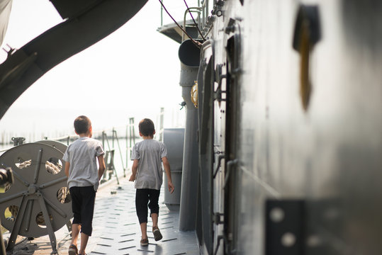 Boy  driving war ship military at the national museam