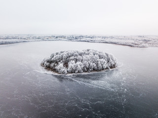 Island in frozen lake - winter wonderland