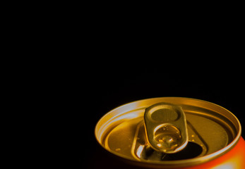Close up can of beer on a black background