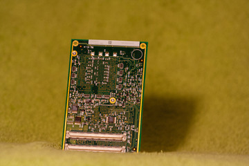 Close up of PCB board on a green background