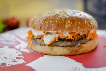 Burger on a stove background. Delicious hamburger cheeseburger. Healthy fresh food cooking eating