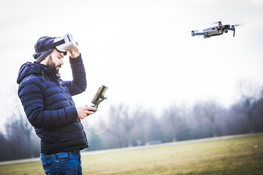 Young man with drone and virtual reality viewer
