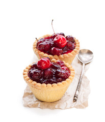 egg  custard tarts with cranberry jam isolated on white