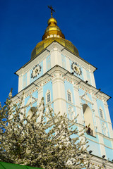 View of St. Michael's Golden-Domed Monastery and blooming tree