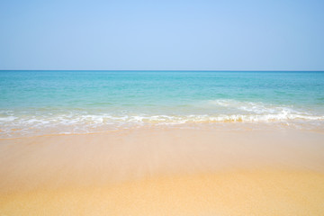 Fototapeta na wymiar Beach and sand with water wave. Sea foam.