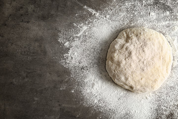 Raw dough on kitchen table, top view
