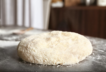 Raw dough on kitchen table