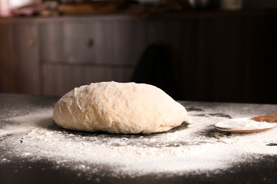Raw dough on kitchen table