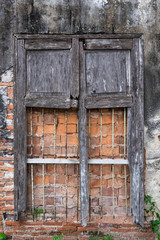 Decayed window and wall texture.