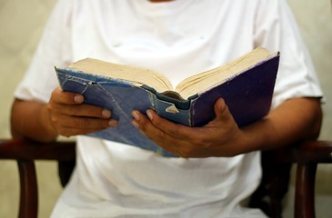 Man reading book in close up