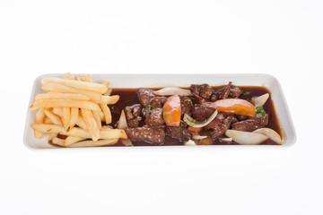 Beef goulash with vegetables and french fries