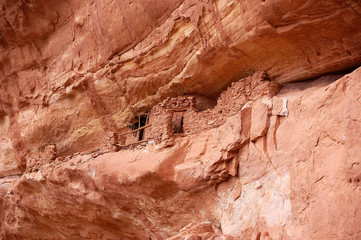 Ancient Anizazi ruins perched on canyon wall in southern Utah Canyon country.
