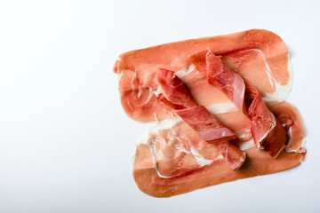 Spanish serrano ham isolated on white