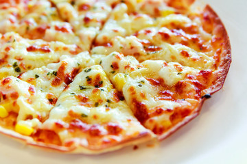 Tortilla Pizza with mozzarella cheese, imitation crab stick, sweet corn and pineapple.