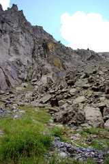 Rocky jagged slope in high mountian colorado setting in the early summer. 