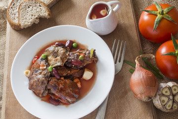 Moroccan dish of fried chicken hot liver in a plate of hot sauce