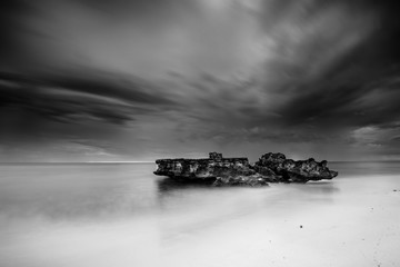 approaching storm trigg point perth western australia in black and white