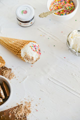 Ice-Cream Plombir In A Waffle Cup With A Topping Of Fresh Blueberries And Syrup, Grated Chocolate, Sprinkles, Overhead View.