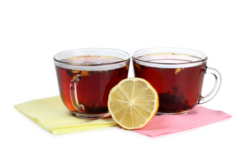 Black tea in a glass cup on a white background