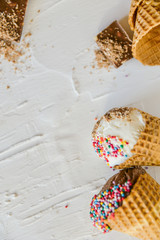 Ice-Cream Plombir In A Waffle Cup With A Topping Of Fresh Blueberries And Syrup, Grated Chocolate, Sprinkles, Overhead View.