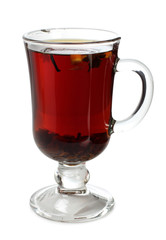 Black tea in a glass cup on a white background