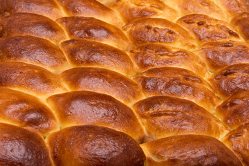 Homemade turnovers with filling are prepared  Latin American style. Concept of wheat spikes home brewing close-up as a background