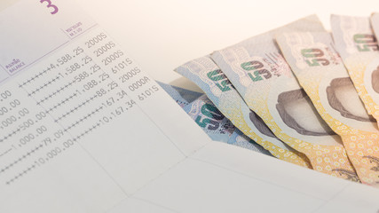 Thai banknote 50 Baht and account book for business concept. business concept. savings concept.