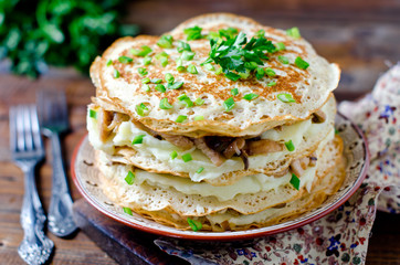 Pancake cake with mushrooms and chicken
