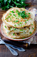 Pancake cake with mushrooms and chicken