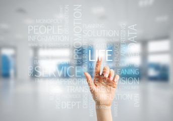 Concept of modern business with palm choocing on of keywords for success