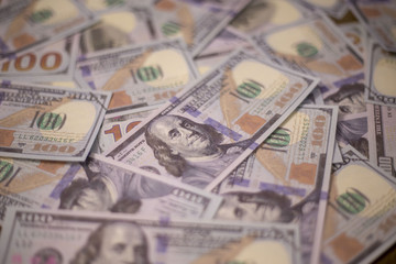 piles of cash currency 100 dollar bills