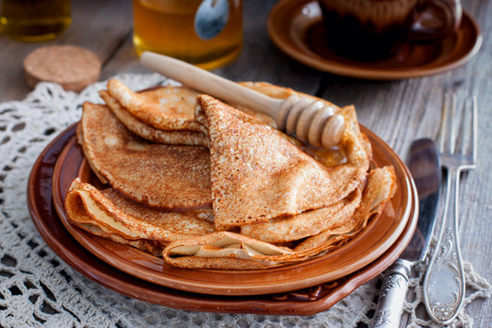 Pancakes for carnival with honey in Russian style, horizontal