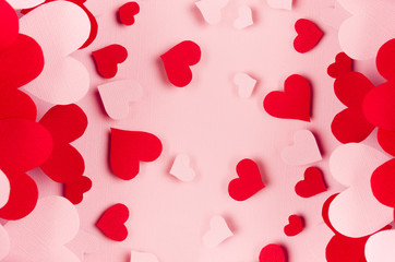 Paper red and pink hearts with blur perspective on soft pink color background. Valentine day concept for design.