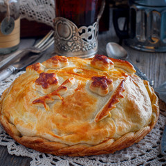 Traditional festive Russian pie - Kournik (pie with chicken and pancakes), square © Анна Журавлева