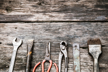 mechanic tools set on dirty wooden background