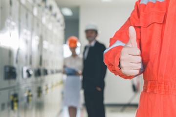 Engineers are checking the electrical system. Selective focus. Engineers and executives are...