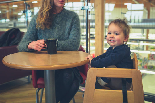 Mother with toddler drinking coffee