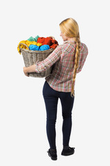 Back view of woman with  basket  dirty laundry. girl is engaged in washing.