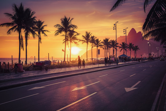Fototapeta Sunset on Ipanema Beach with Dois Irmaos mountains in Rio de Janeiro, Brazil. Violet tone