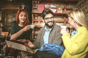 Group of students study at cafe.