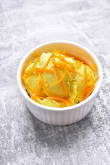 Tasty orange ice cream in bowl