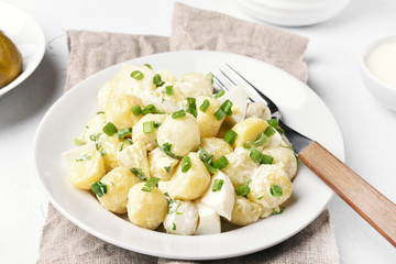 Potato salad with eggs and green onion